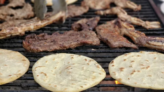 Thin steaks for carne asada grilling next to corn tortillas
