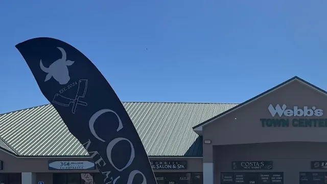 Costa's Meat Market flag outside the store in Davenport, FL